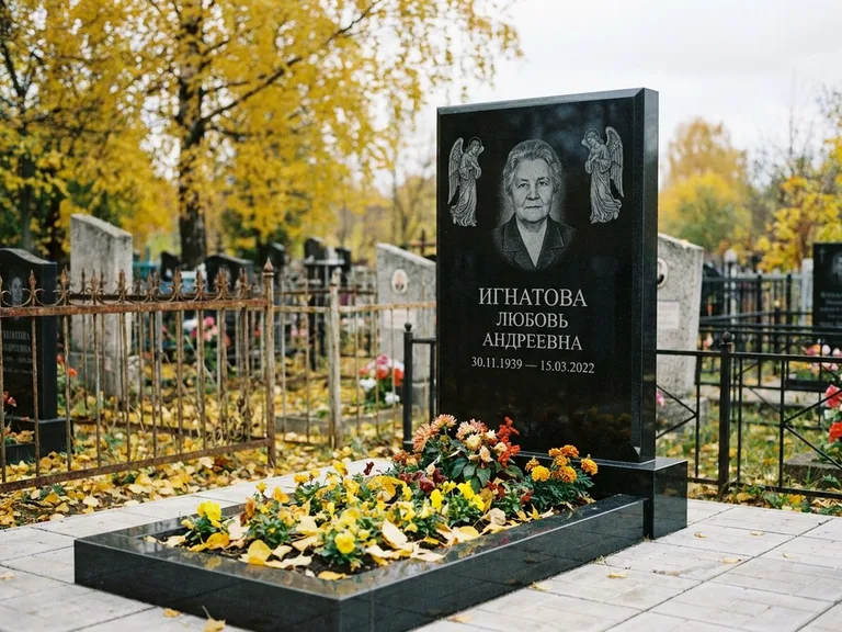Памятник с гравировкой ангела — гравировка двух ангелов по сторонам портрета, работа «Игнатова» в Саратове