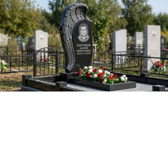 Памятник-стела с крылом ангела из черного габбро-диабаза